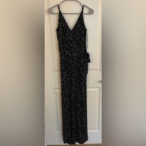 Black with white pattern jumpsuit, v neck tie front size M